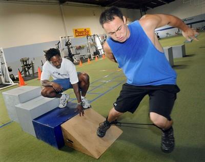 Me and Eric newspaper photo Rehab training